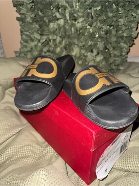 Salvatore Ferragamo Black Slides with Gold Logo